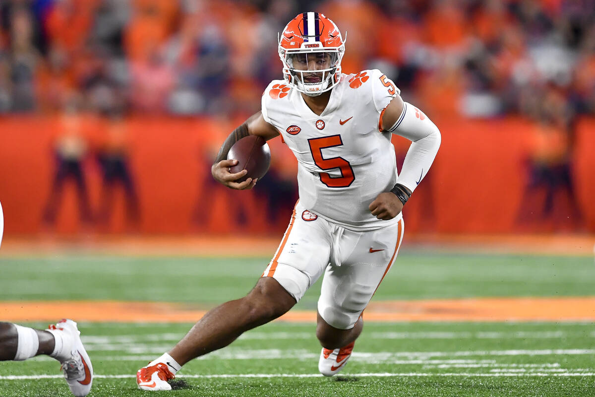 Clemson quarterback DJ Uiagalelei (5) runs with the ball during the second half of an NCAA coll ...