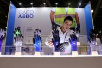 Isaac Joel Abbo of Caco America in Miami sets up his safety equipment products on the first day ...