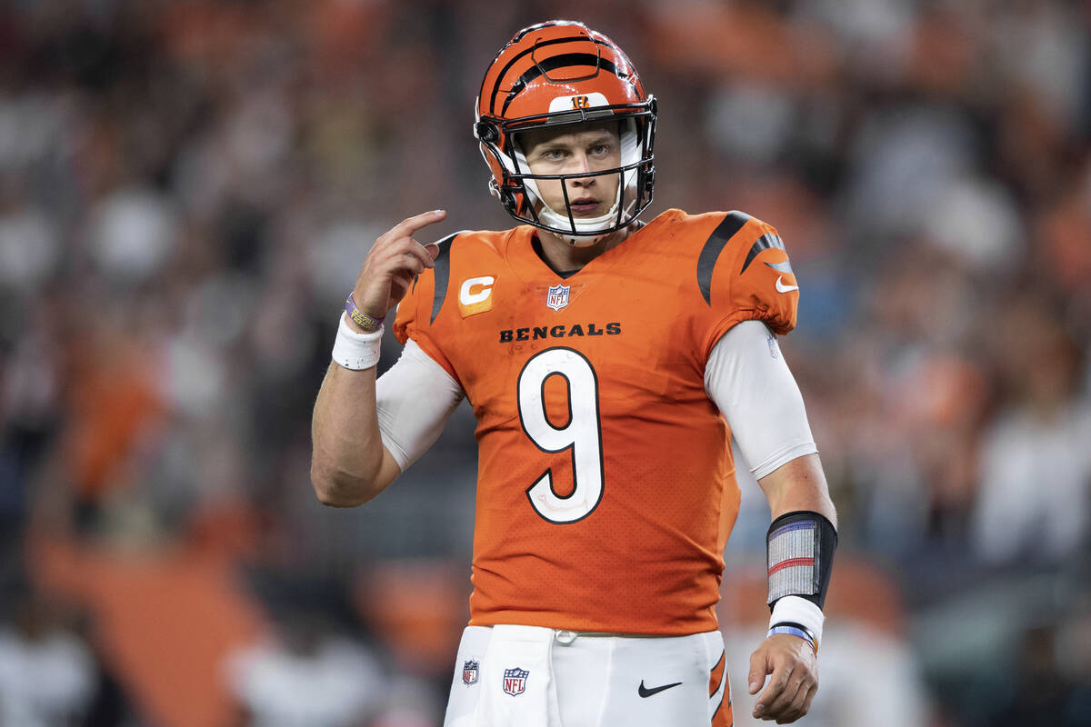 Cincinnati Bengals quarterback Joe Burrow (9) walks to the sidelines during an NFL football gam ...