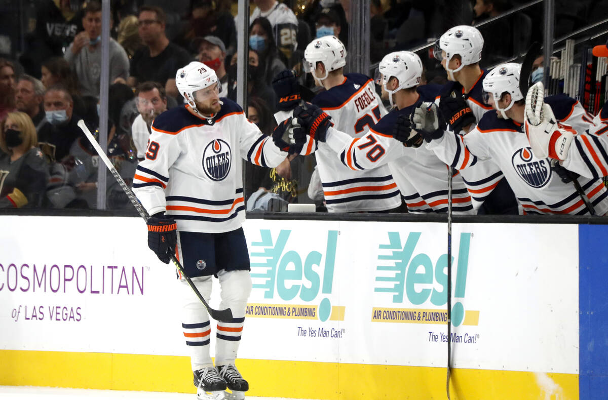 Edmonton Oilers center Leon Draisaitl (29) is congratulated by teammates after scoring during t ...