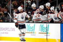 Edmonton Oilers center Leon Draisaitl (29) is congratulated by teammates after scoring during t ...