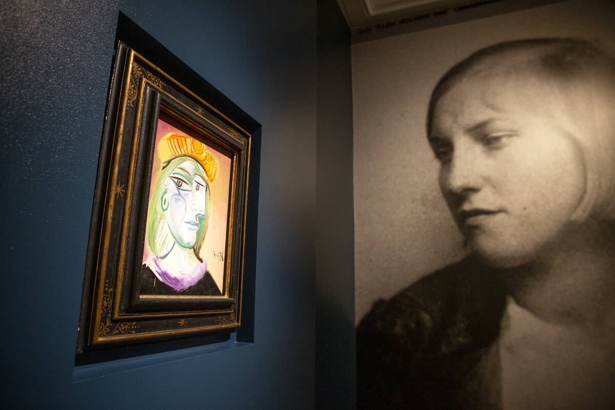 Pablo Picasso's "Femme au beret rouge-orange" is on display at the Bellagio Gallery o ...
