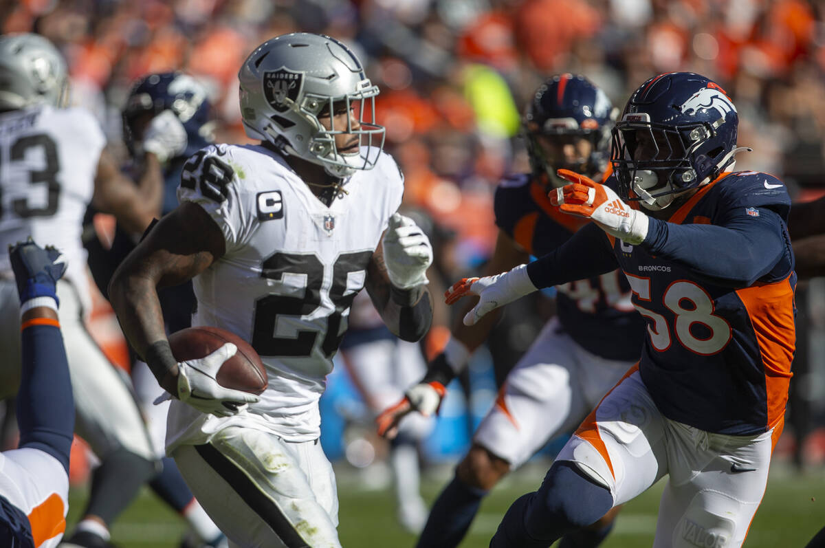 Denver Broncos outside linebacker Von Miller (58) looks to tackle Raiders running back Josh Jac ...