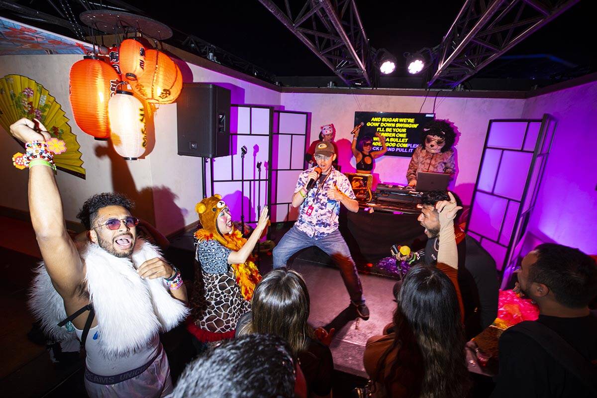 Attendees relax by the Tokyo Karaoke Bar during the second day of the  Electric Daisy Carnival a …