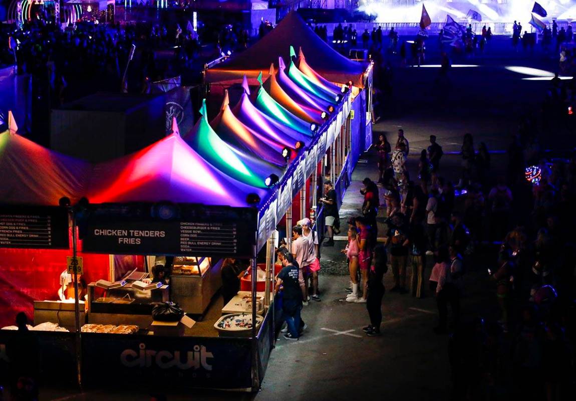 Attendees line up for food vendors during the first day of the Electric Daisy Carnival at the L ...