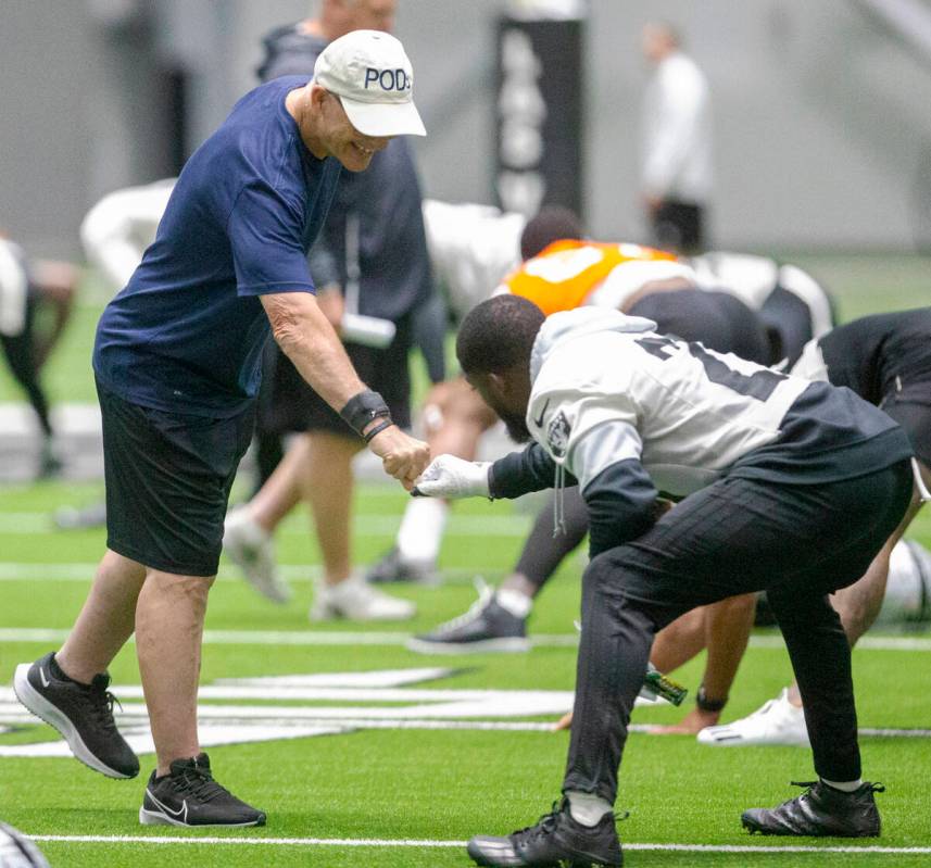 Raiders defensive line coach Rod Marinelli gives a pound to Raiders cornerback Amik Robertson ( ...