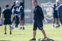 Raiders offensive coordinator Greg Olson walks the field during a practice session at the Raide ...