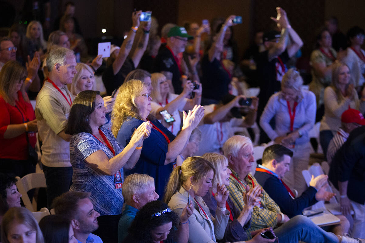 The audience at the Qanon-linked Patriot Voice convention applauds for speakers at Ahern Hotel ...