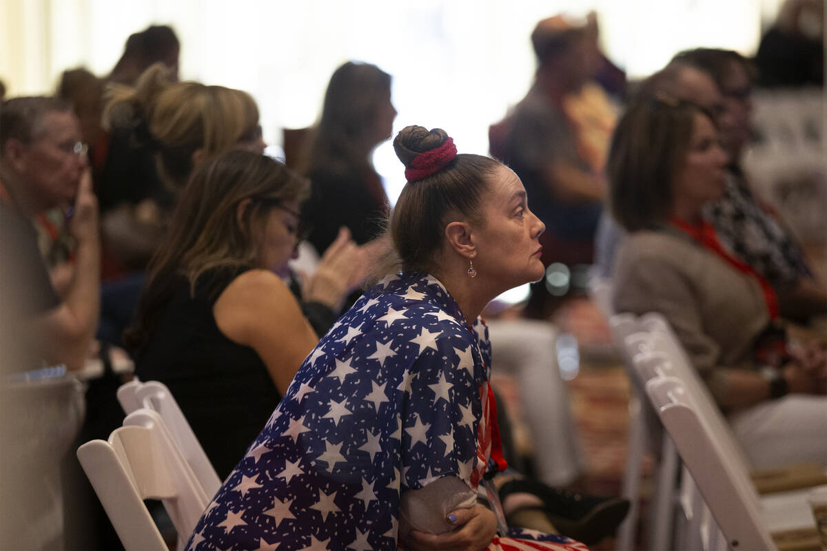 Audience members listen to speakers during the Qanon-linked Patriot Voice convention at Ahern H ...