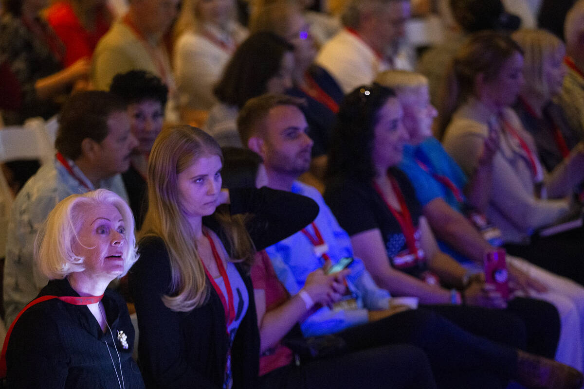 Audience members listen to speakers during the Qanon-linked Patriot Voice convention at Ahern H ...