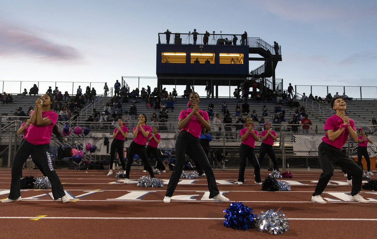 Desert Pines cheerleaders hype up their team during the first half of a high school football ga ...