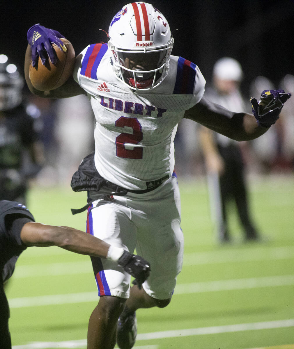 Liberty's Germie Bernard makes it to the endzone for a touchdown during the first half of a hig ...