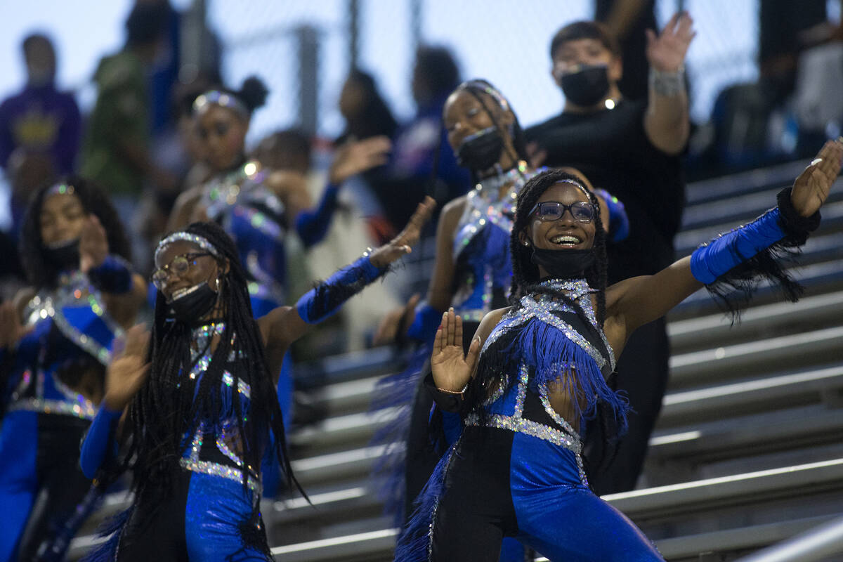 Desert Pines cheerleaders cheer on their team during the first half of a high school football g ...