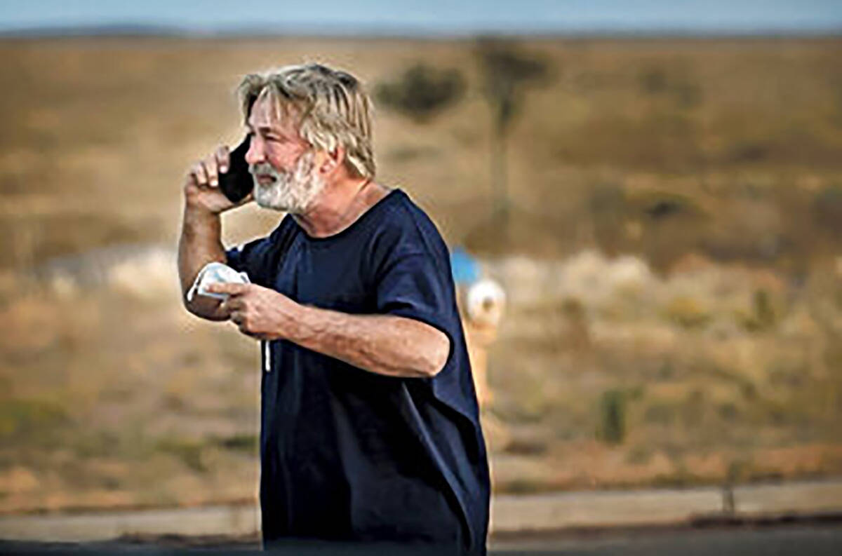 Alec Baldwin speaks on the phone in the parking lot outside the Santa Fe County Sheriff's Offic ...