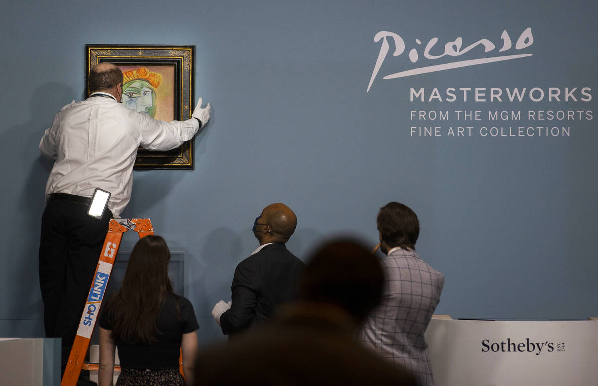 One of eleven of Pablo Picasso’s works being featured is hung before the start of an auc ...