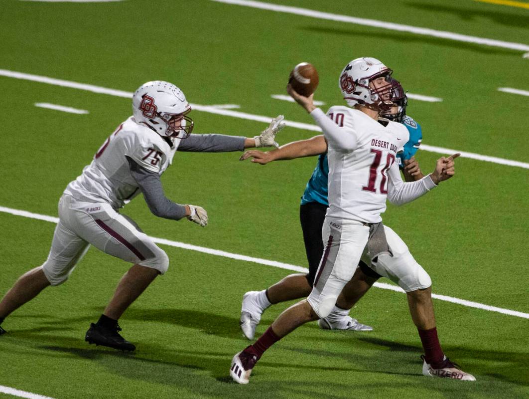 Desert Oasis quarterback Tyler Stott (10) throws under pressure against Silverado High during t ...