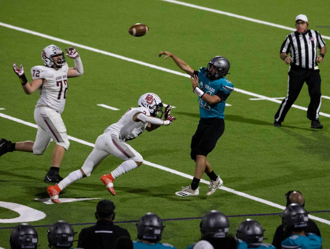 Siverado HighÕs quarterback Brandon Tunnell (11) throws under pressure against Desert Oasi ...