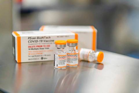This October 2021 photo provided by Pfizer shows kid-size doses of its COVID-19 vaccine in Puur ...
