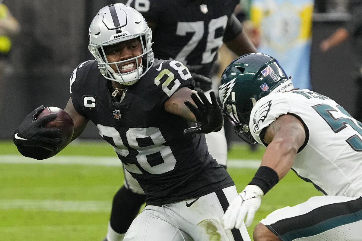 Las Vegas Raiders running back Josh Jacobs (28) runs for a gain against the Philadelphia Eagles ...