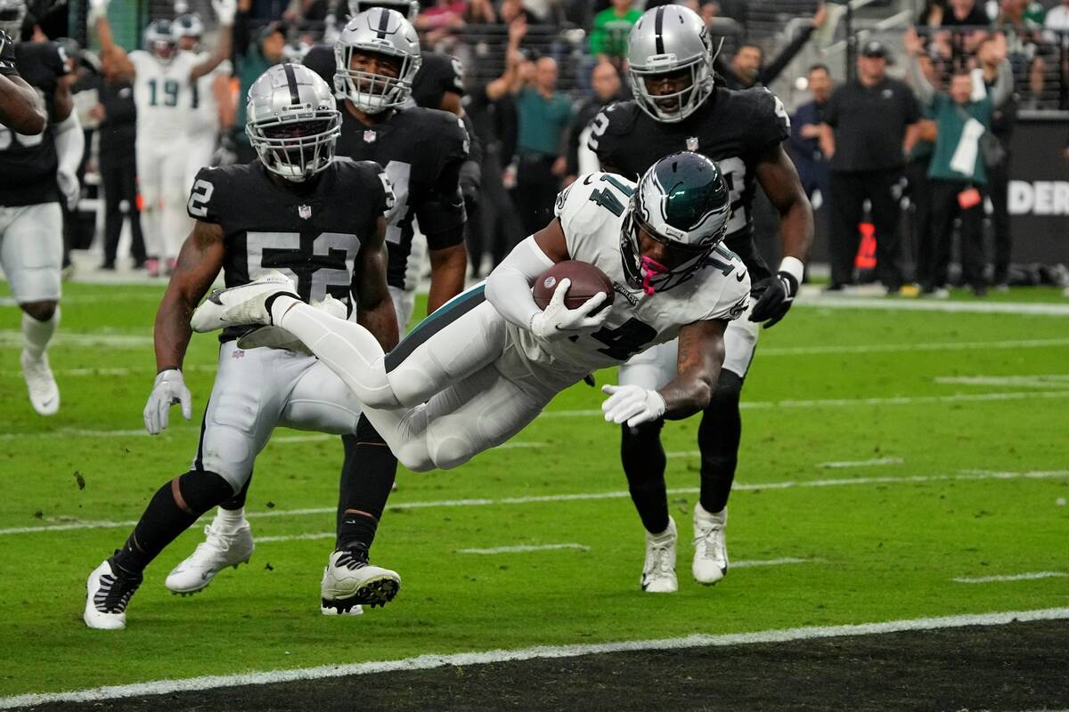 Philadelphia Eagles running back Kenneth Gainwell (14) dives into the end zone for a touchdown ...