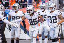 Raiders free safety Trevon Moehrig (25) celebrates an interception with teammates versus the De ...