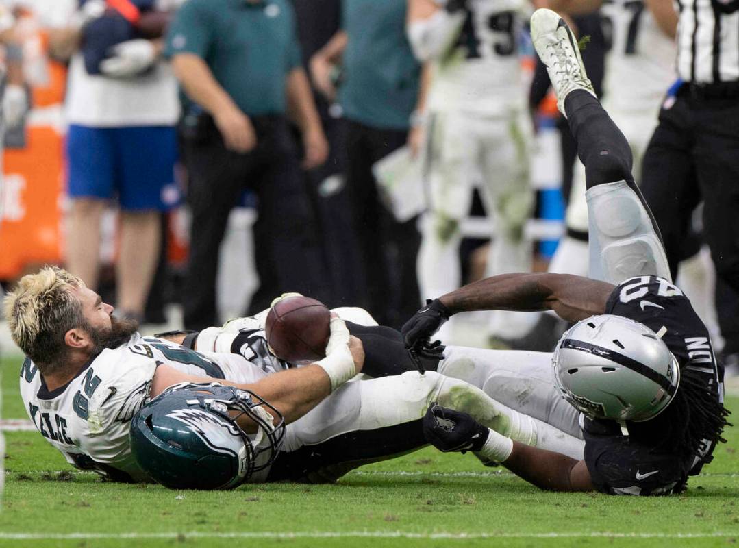 Philadelphia Eagles center Jason Kelce (62) fights for a fumble with Raiders inside linebacker ...