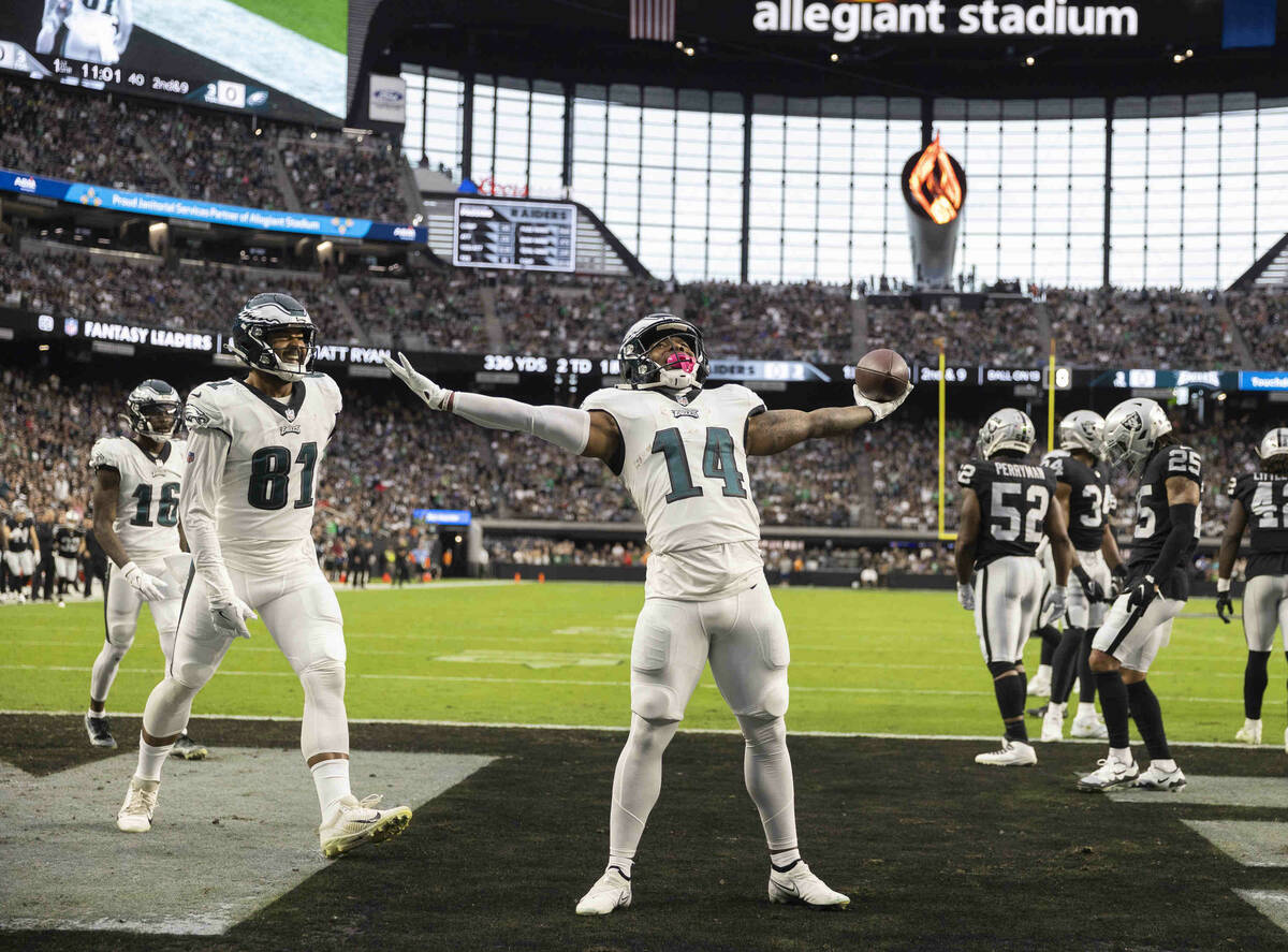 Philadelphia Eagles running back Kenneth Gainwell (14) celebrates a touchdown run in the first ...