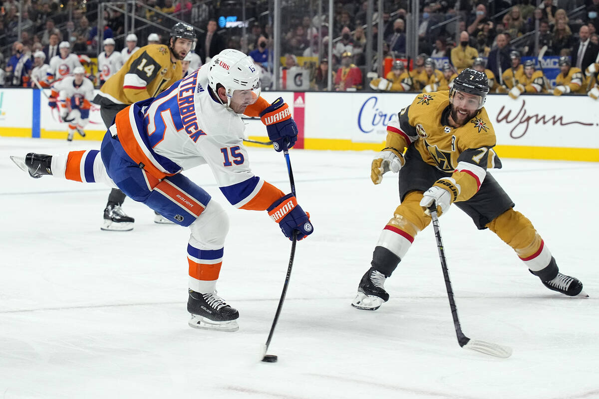 New York Islanders right wing Cal Clutterbuck (15) shoots in front of Vegas Golden Knights defe ...