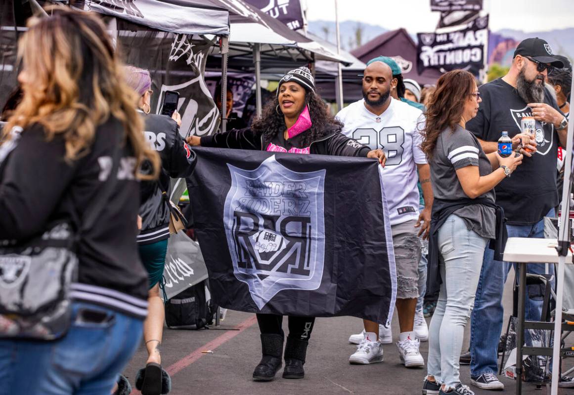 The Raider Riders from Los Angeles parade through tailgating before the first half of an NFL ga ...