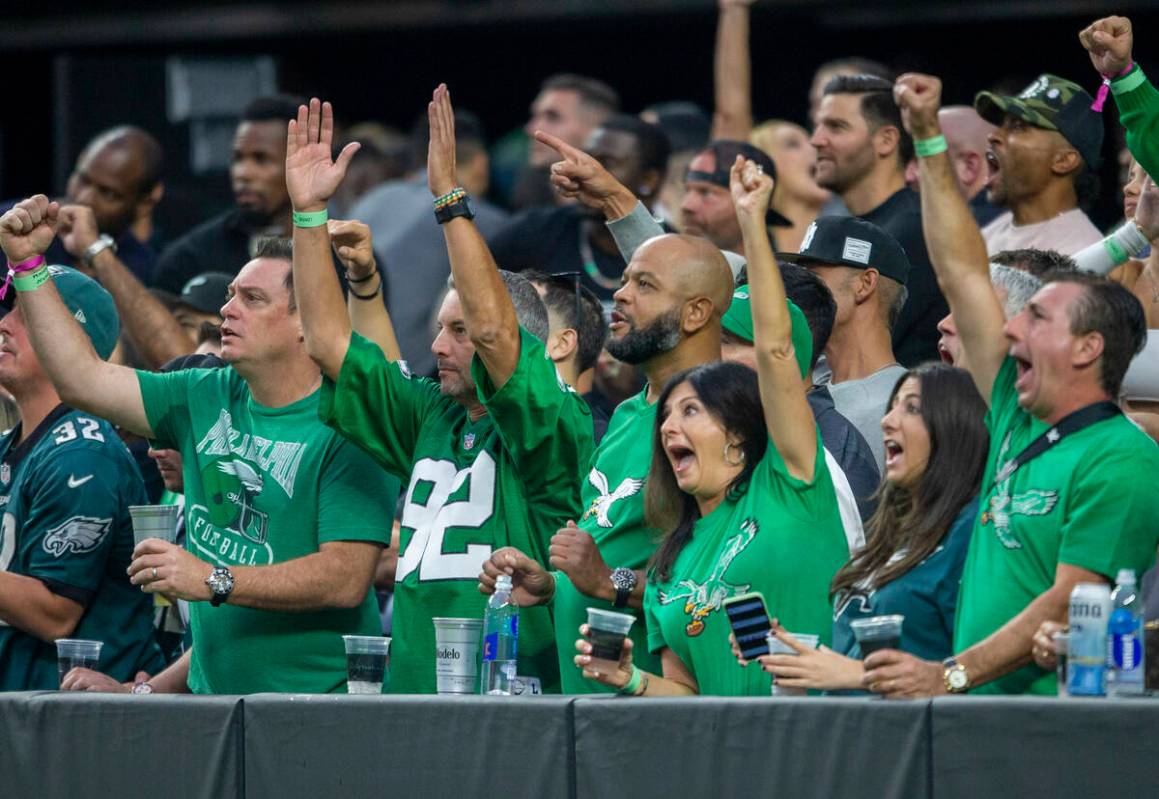 Philadelphia Eagles fans cheer after a touchdown is scored during the first quarter of an NFL f ...