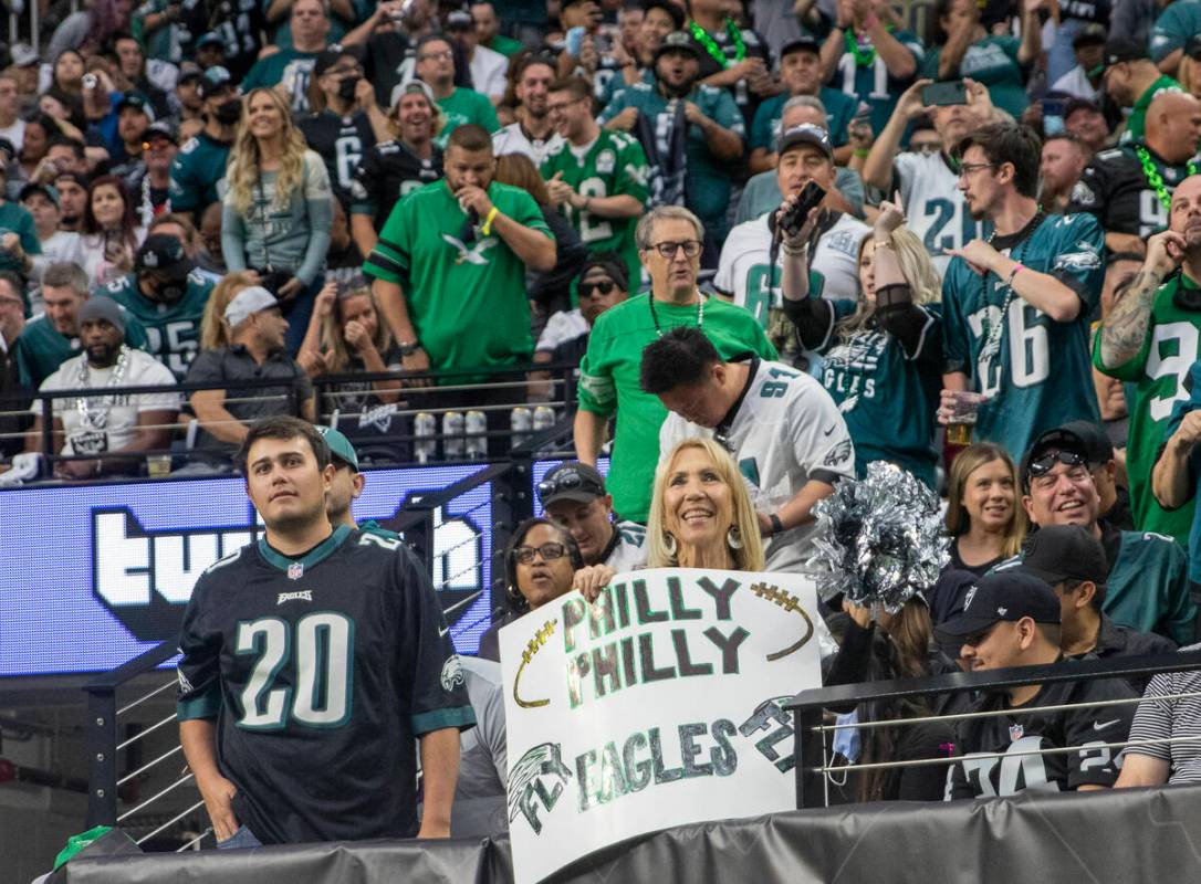 Philadelphia Eagles fans cheer during the first quarter of an NFL football game against the Rai ...