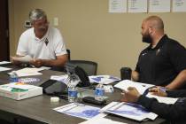 Aces general manager Dan Padover (middle) meets with head coach Bill Laimbeer and assistant coa ...