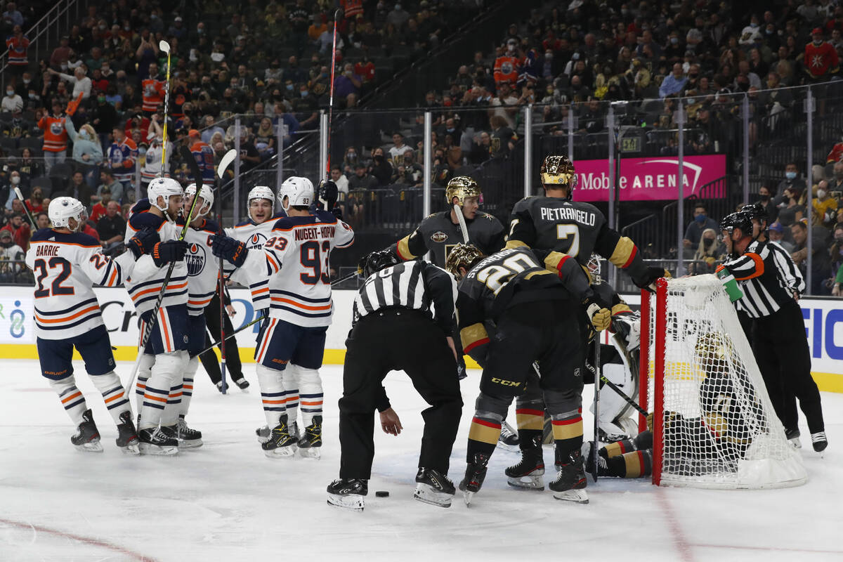 Edmonton Oilers celebrate a goal by left wing Zach Hyman (18) as Vegas Golden Knights center Wi ...