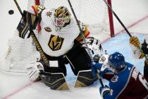 Vegas Golden Knights goalie Robin Lehner, left, deflects a shot off the stick of Colorado Avala ...