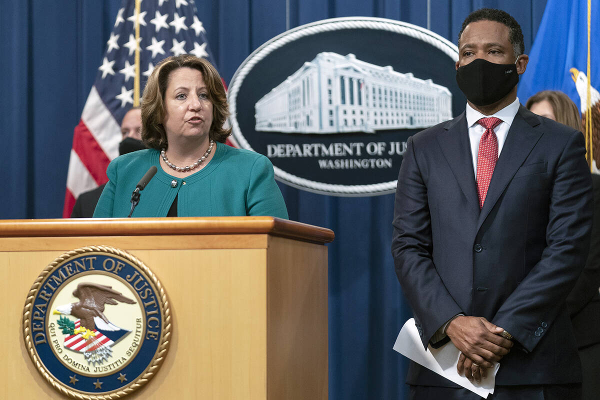 Deputy Attorney General Lisa Monaco, with Assistant Attorney General Kenneth Polite Jr. of the ...