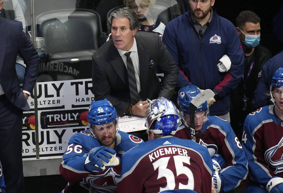 Colorado Avalanche head coach Jared Bednar, back, directs his team against the Vegas Golden Kni ...