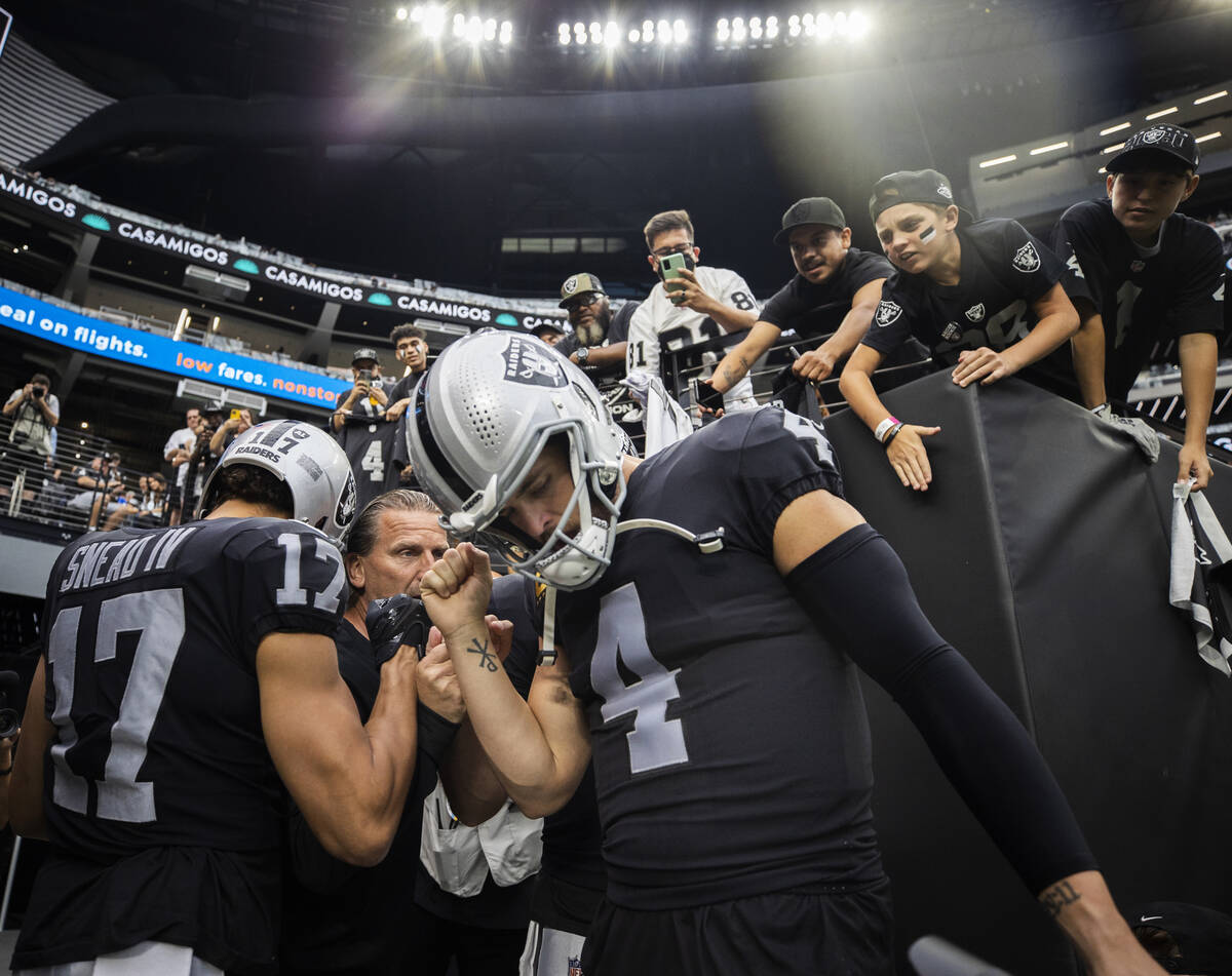 Las Vegas Raiders quarterback Derek Carr (4) and Las Vegas Raiders wide receiver Willie Snead ( ...