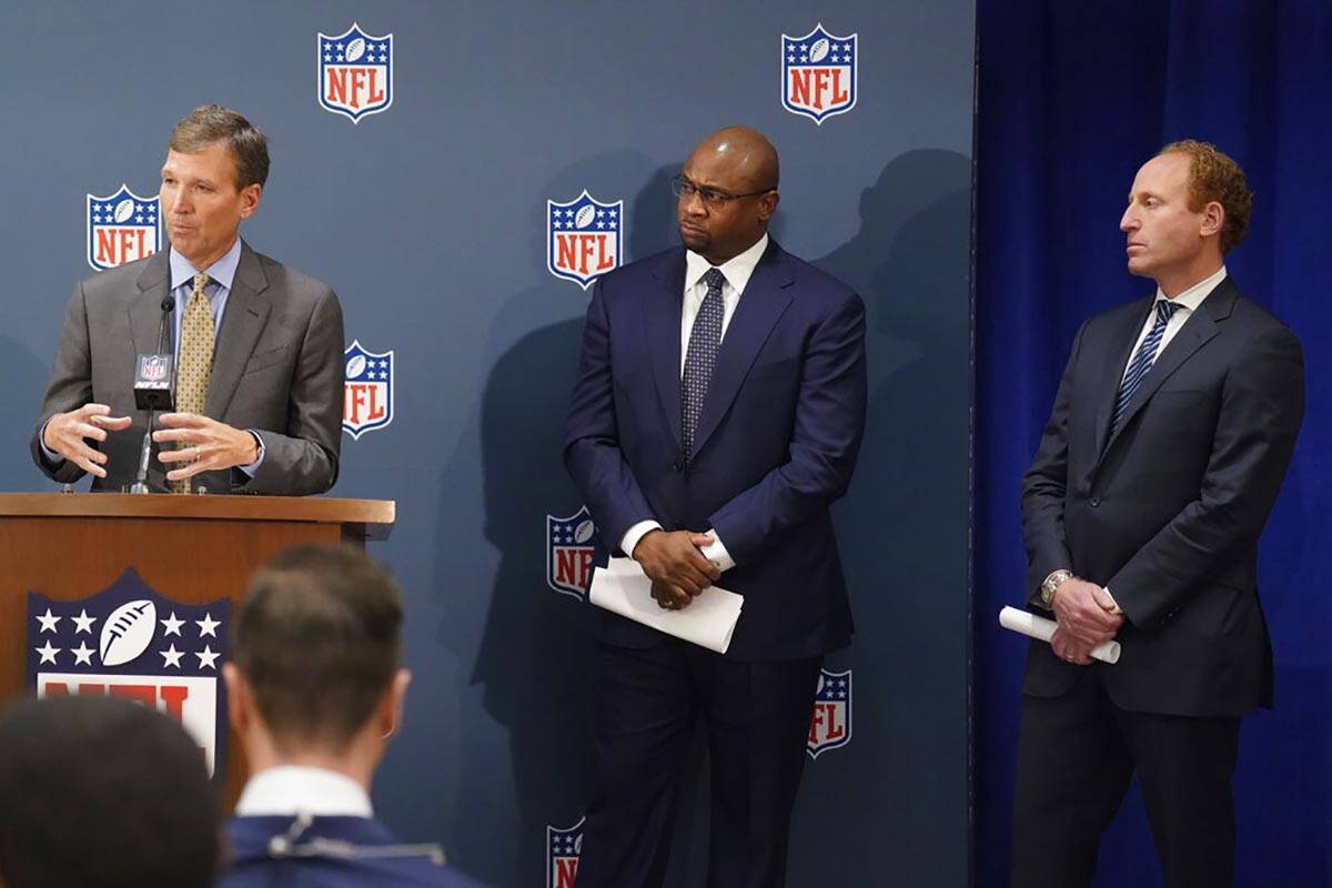 Allen Sills, Chief Medical Officer for the NFL, left, Troy Vincent, Executive Vice President of ...