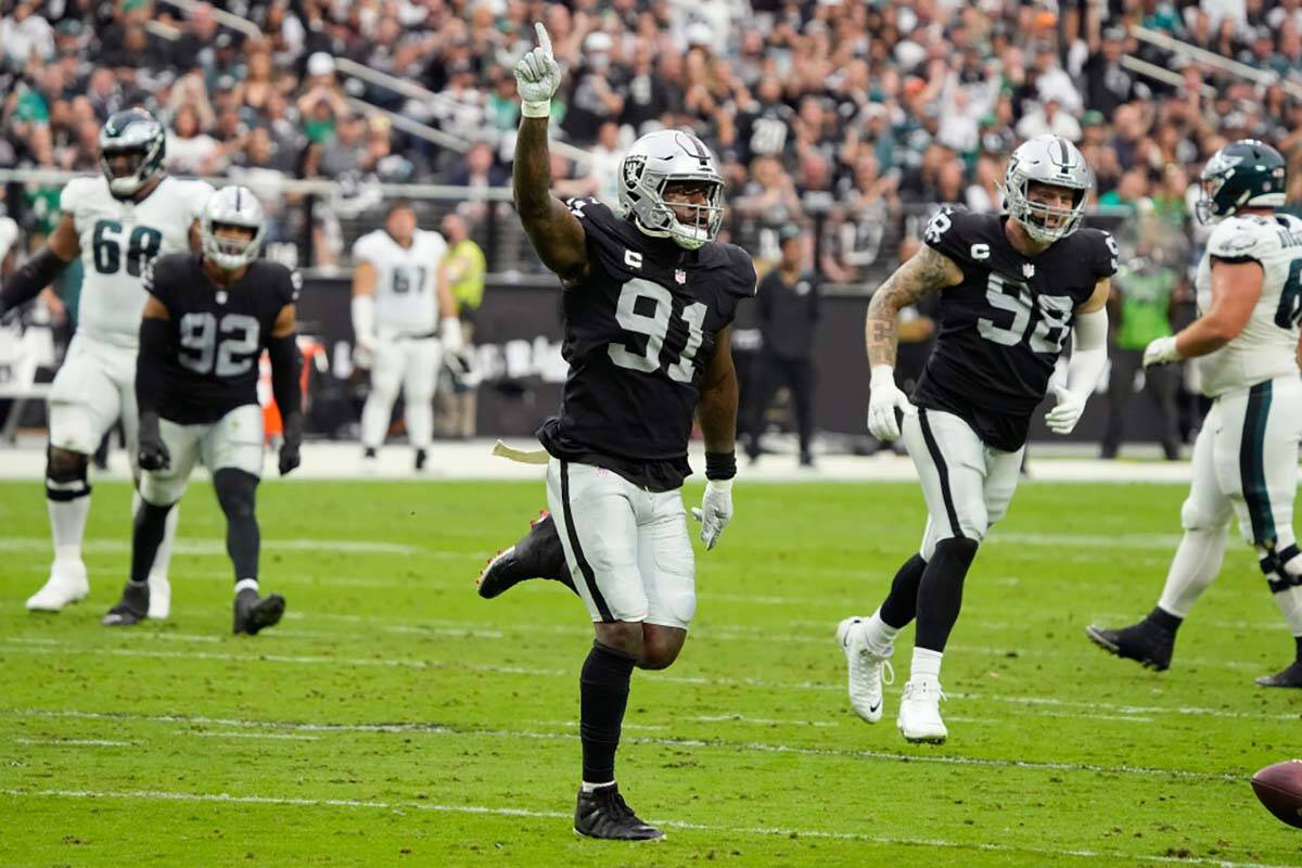 Las Vegas Raiders defensive end Yannick Ngakoue (91) celebrates after blocking a pass attempt a ...