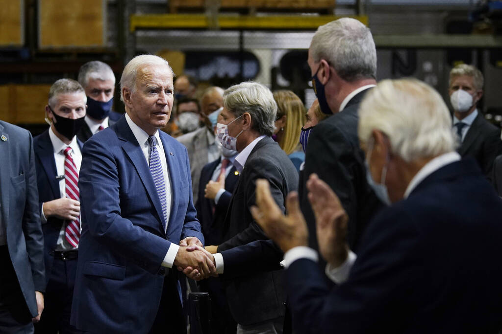 President Joe Biden greets the audience after delivering remarks at the NJ Transit Meadowlands ...