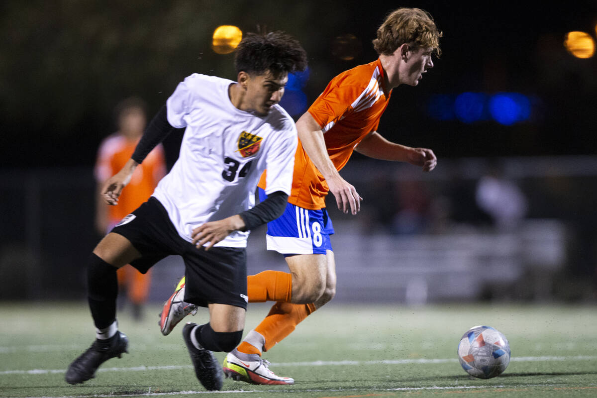 Las Vegas' Cristian Cruz (34) loses control of the ball to Bishop Gorman's Nathaniel Roberts (8 ...