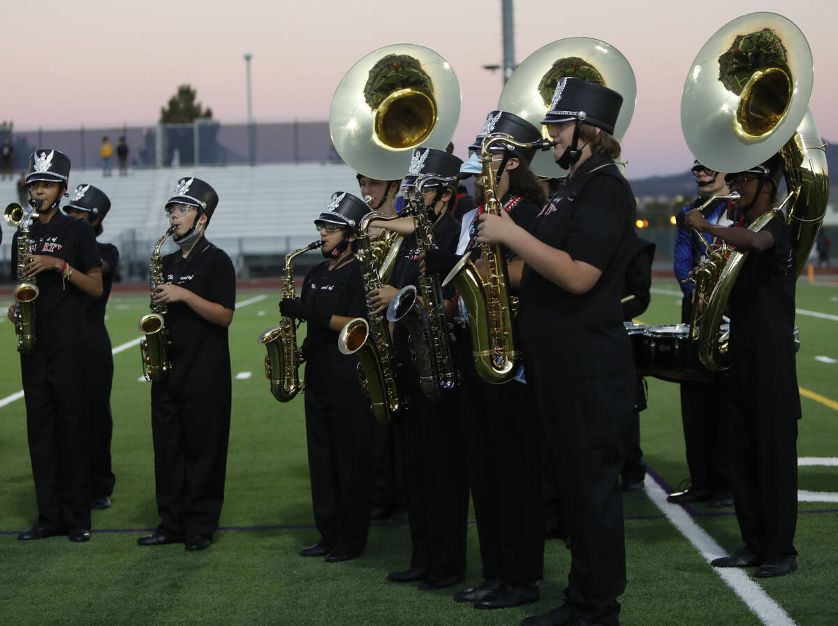 Liberty High School's marching band performs before a football game against Legacy High School, ...