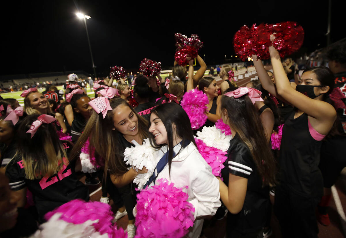 Liberty High School's cheerleaders celebrate their victory against Legacy High School after a f ...