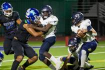 Foothill place holder LJ Wallick (3) picks up he ball and will throw a pass to a teammate for a ...