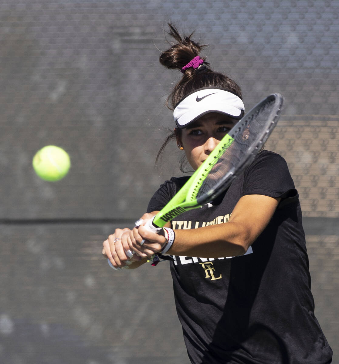 Faith LutheranÕs Taylor Nelson returns the ball against Palo HighÕs Venus Tang during ...