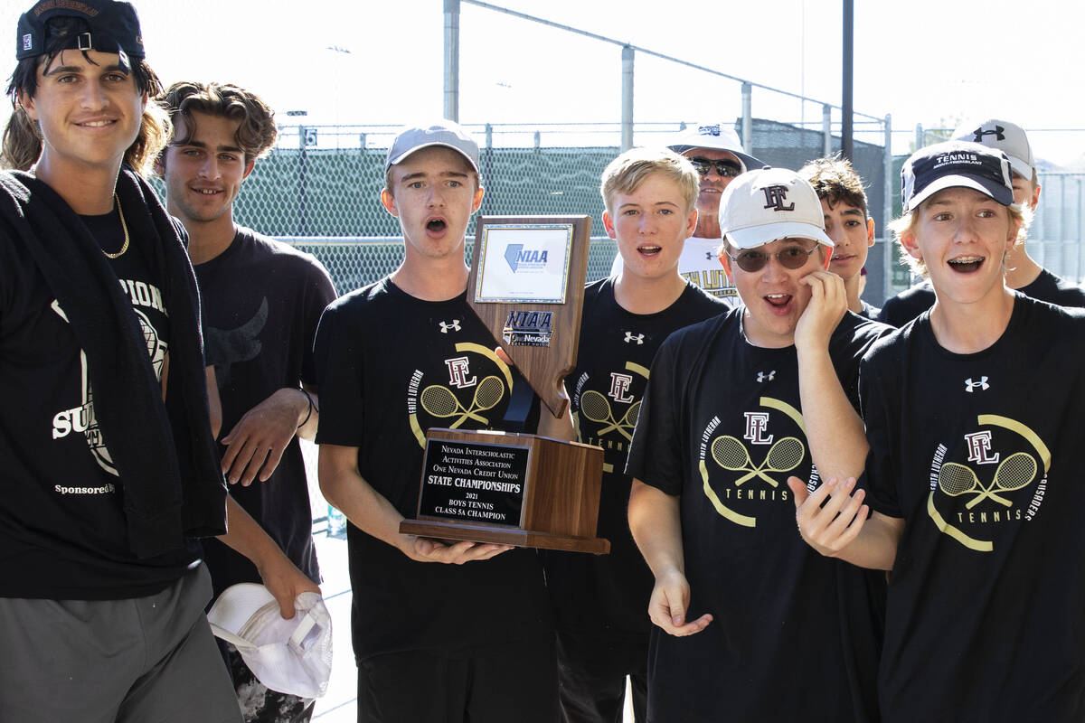 Faith Lutheran players celebrate after wining Class 5A team championship tennis match against P ...