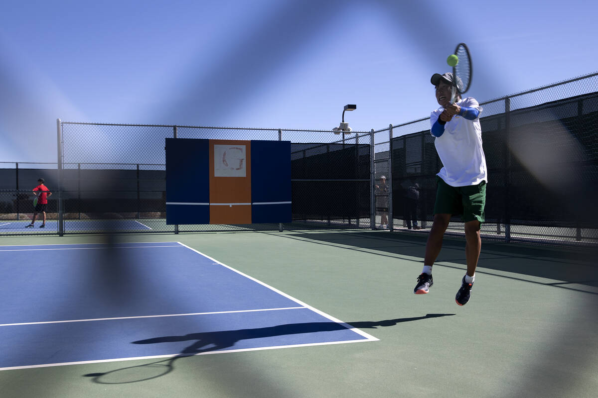 Bishop Manogue's Masato Kato hits to Clark's Sanjeev Chundu during a boys singles class 5A cham ...