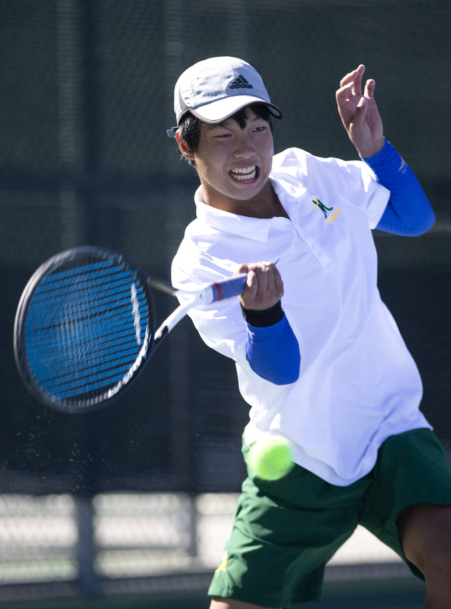 Bishop Manogue's Masato Kato hits to Clark's Sanjeev Chundu during a boys singles class 5A cham ...