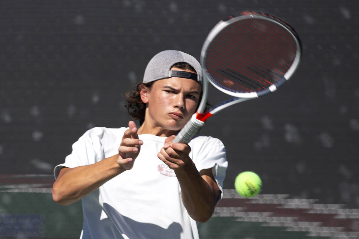 Reno's Brody Friedman hits to Faith Lutheran during a boys doubles class 5A championship match ...