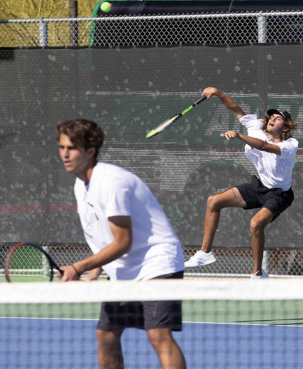Faith Lutheran's Nicco Ripamonti hits to Reno while playing a boys doubles match with Stephen D ...